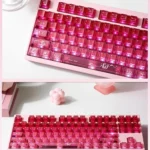 A collection of playful luminous cinnabar pink gradient keycaps set for mechanical keyboards, showcasing their delicate transparency and glowing charm.