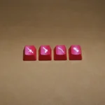 Vibrant, translucent CSGO weapon keycaps, featuring iconic red-lit weapon silhouettes from an overhead view, enhancing any gamer's setup.