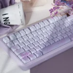 Artistic Custom PBT Keycaps set displaying the dreamy rabbit and flower gradient designs and unique side-lit Cherry profile from multiple perspectives.