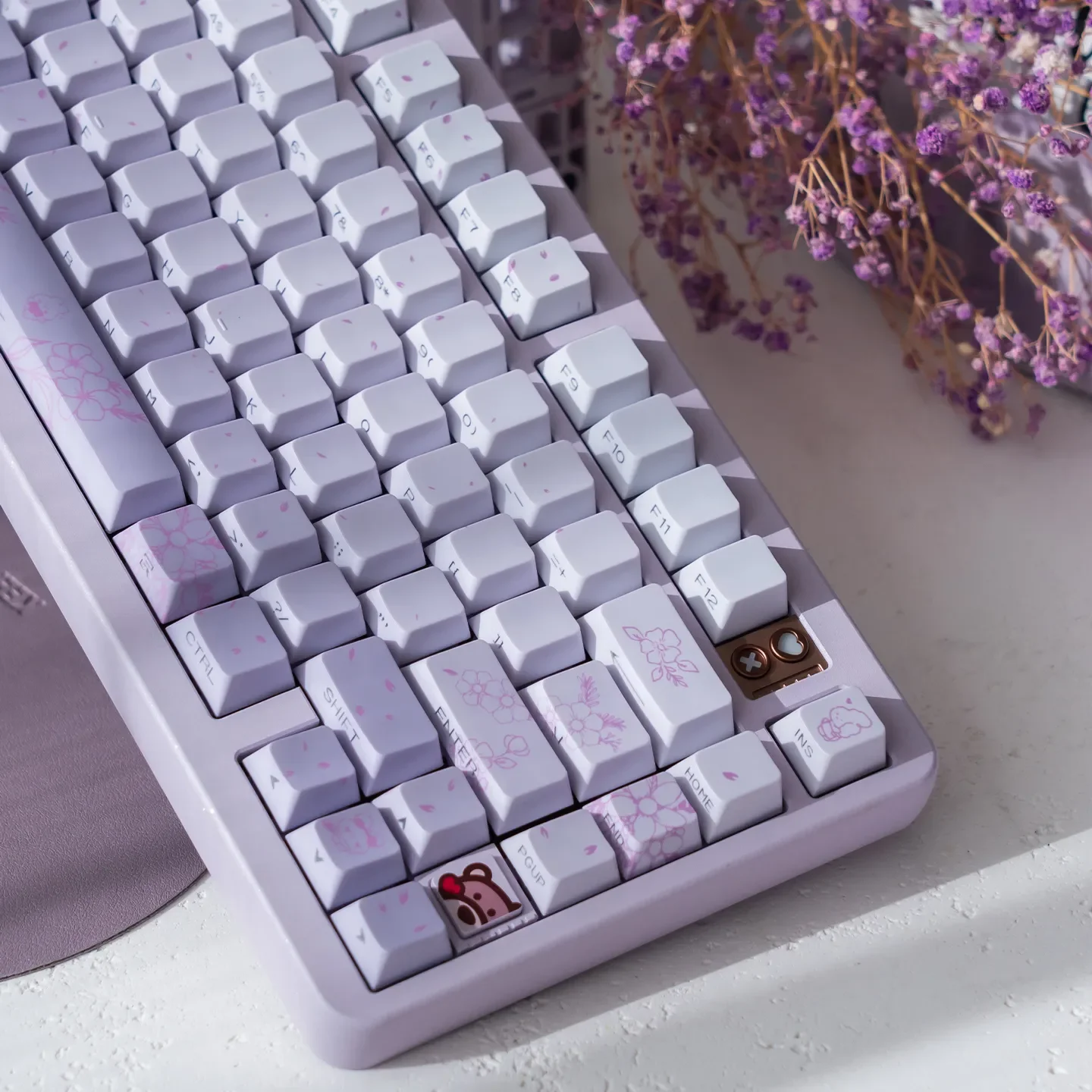 Artistic close-up of the Dreamy Rabbit & Flower Gradient Custom PBT Keycaps set, showcasing whimsical pastel dye-sub designs and elegant side-lit.