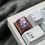 Premium Cyrene Ice Crystal Titanium Keycap ESC showcasing its shimmering artisan titanium alloy and unique anime-inspired design.