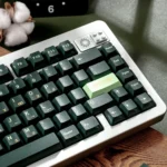 Product gallery featuring durable Dark Green PBT Dye-Sub Keycaps Set, showcasing their unique Cherry profile and refreshing deep forest green aesthetic.