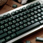 Durable dark green PBT keycap set, Cherry profile dye-sub set. Multi-angle view of premium forest green aesthetic for custom mechanical keyboards.