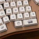 Showcasing the full adorable PBT dye-sublimated dessert keycaps set from different angles, with sweet pastel cakes, donuts, and candies.