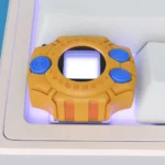 This gallery displays the iconic 3D Digimon virtual pet keycap from various perspectives, an authentic and intricate miniature replica for custom keyboard.