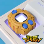 Iconic 3D Digimon virtual pet device keycap, an authentic miniature replica, perfectly showcasing the classic design on a custom mechanical keyboard.