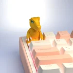 Vibrant handcrafted resin Digimon keycaps, detailed character sculpts viewed from multiple angles, bringing childhood adventures to your keyboard.