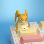 Multiple handcrafted resin Digimon keycaps, vibrant and detailed 3D sculpted characters shown from various angles, capturing their playful artistry.