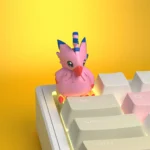 Vibrant handcrafted resin Biyomon Digimon keycap, featuring the detailed pink avian character for a unique mechanical keyboard.