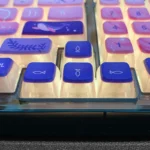 A collection of luminous Dreamy Ocean Anime Pudding Keycaps Set, seen from various angles, highlighting their vibrant underwater fantasy designs and soft design.