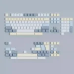 Eternity Moon on Sea magnetic keycaps set shown from various angles. Serene blue and luminous white evoke the ethereal ocean, highlighting magnetic compatibility.