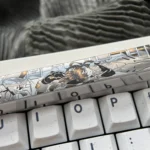 Artistic gallery view of the Evangelion Asuka precision-engraved titanium keycap, revealing its iconic sci-fi design and vibrant colors.