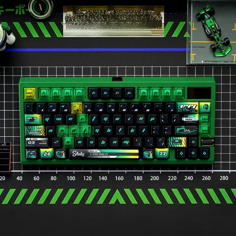 Premium F1 keycap set featuring the exclusive C44 Zhou Guanyu livery, vibrant black and green race car motifs, perfect for gaming keyboards.