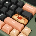 Gallery showcasing the hand-sculpted whimsical reindeer artisan Christmas keycap from various angles, emphasizing its intricate hand-painted festive design.