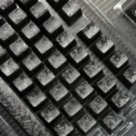 Authentic Forged Carbon Keycap Set showcasing its dynamic, matte translucent texture and sophisticated, dark luxury design.