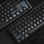 Gallery showcasing authentic Forged Carbon Keycap Set. Matte translucent finish and dynamic texture captivate, exuding dark sophistication.