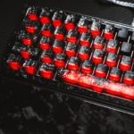 A gallery view of the Authentic Forged Carbon Keycap Set, showcasing its matte translucent finish and dynamic texture with subtle backlighting.