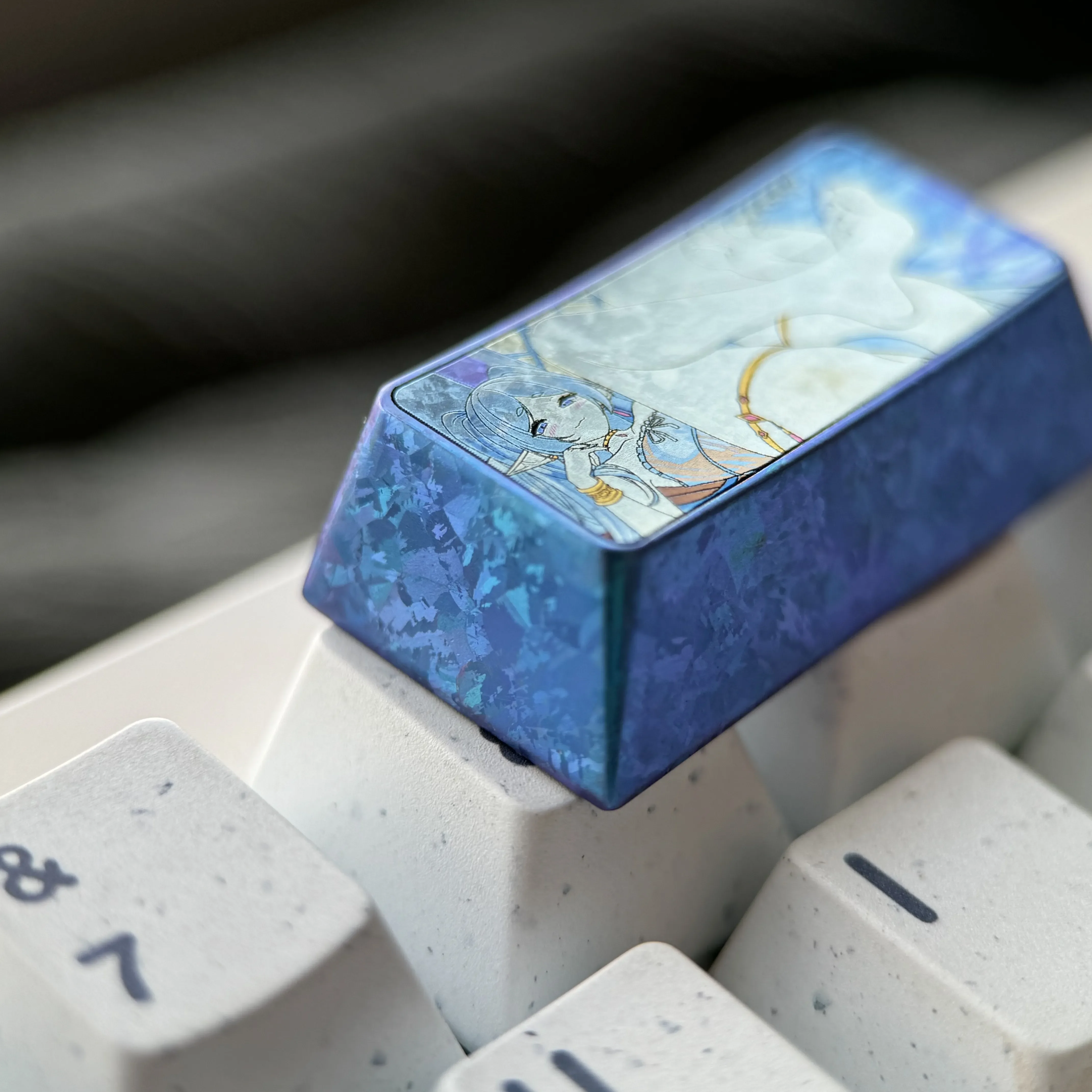 Frieren Keycap handcrafted colorful titanium 2U backspace keycap. Artistic gallery highlights vibrant finish and intricate Elven Mage details.