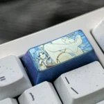 Gallery of the artistic Frieren Keycap, revealing its handcrafted colorful titanium, intricate Elven Mage details, and 2U backspace from different angles.