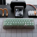 A gallery of Ethereal Frosted Emerald PC Keycap Set, showcasing their refreshing translucent glow and modern aesthetic from various perspectives design.