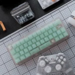 A full set of refreshing frosted emerald PC keycaps set, displaying their ethereal translucent glow and modern aesthetic from various angles.