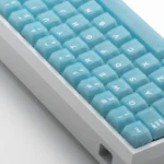 Collection of refreshing frosted light blue PC keycaps set, showcasing gentle translucence and premium finish from multiple angles.
