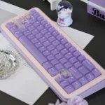 Ethereal light purple frosted PC keycaps set showcasing their pastel mist-like translucence, a premium set for a unique keyboard aesthetic.
