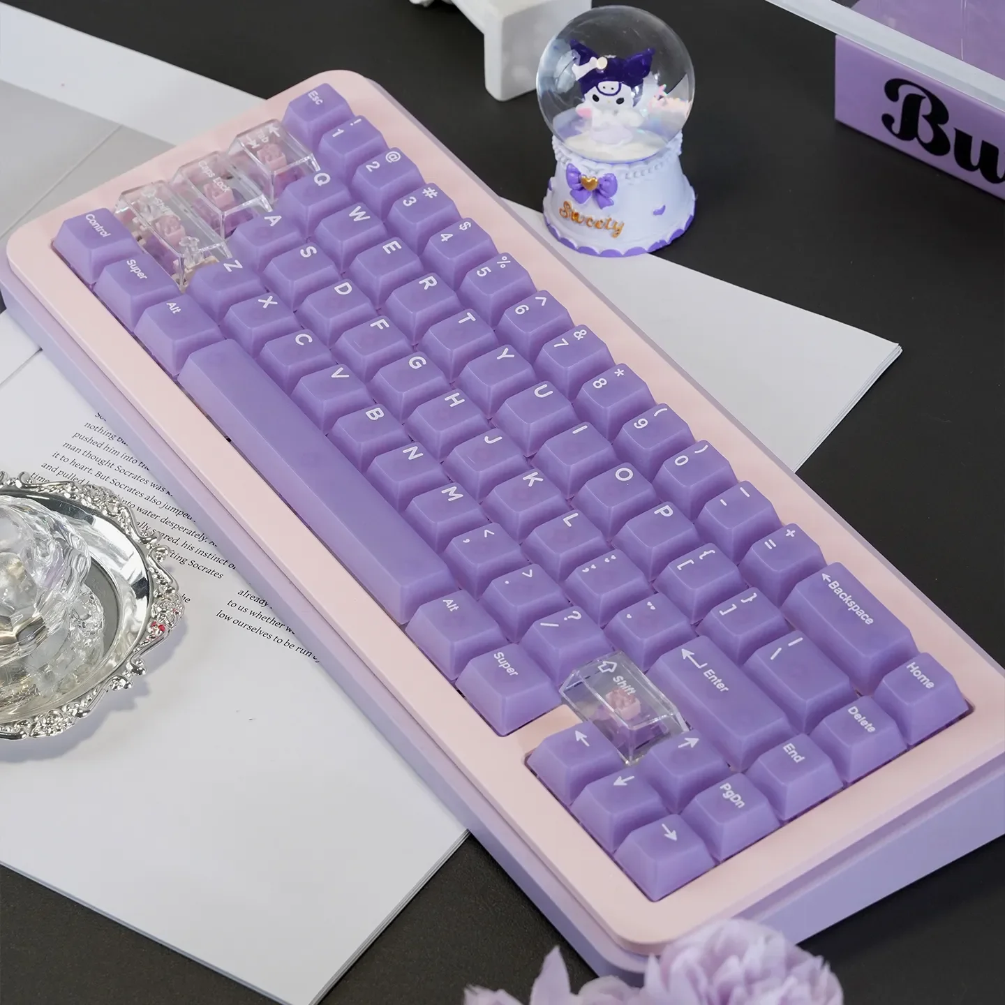 Ethereal light purple frosted PC keycaps set showcasing their pastel mist-like translucence, a premium set for a unique keyboard aesthetic.