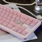 Premium gallery of ethereal frosted pink translucent PC keycaps set from various angles, showcasing their dreamy, soft pastel glow and unique frosted design.