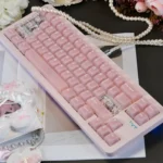 Ethereal frosted pink translucent PC keycaps set glowing softly on a modern keyboard, capturing a dreamy aesthetic with diffused light.