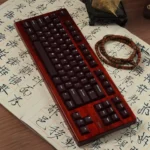 Elegant frosted wine red PC keycaps set for magnetic switches, showcasing their unique translucent glow and premium texture in a full 132-key set.