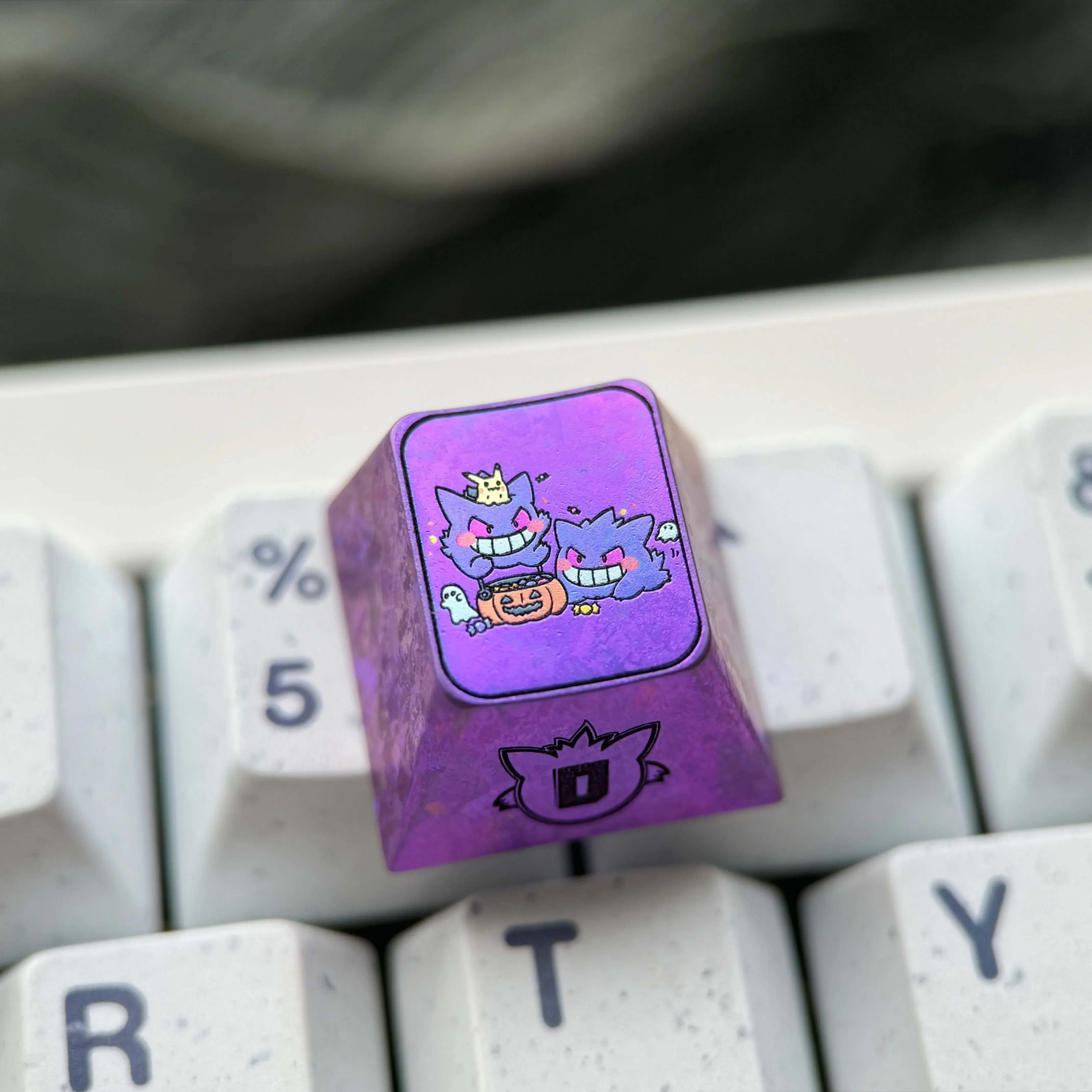 Stunning premium titanium alloy Gengar artisan keycap, custom-crafted with a metallic purple finish, perfect for unique mechanical keyboards.