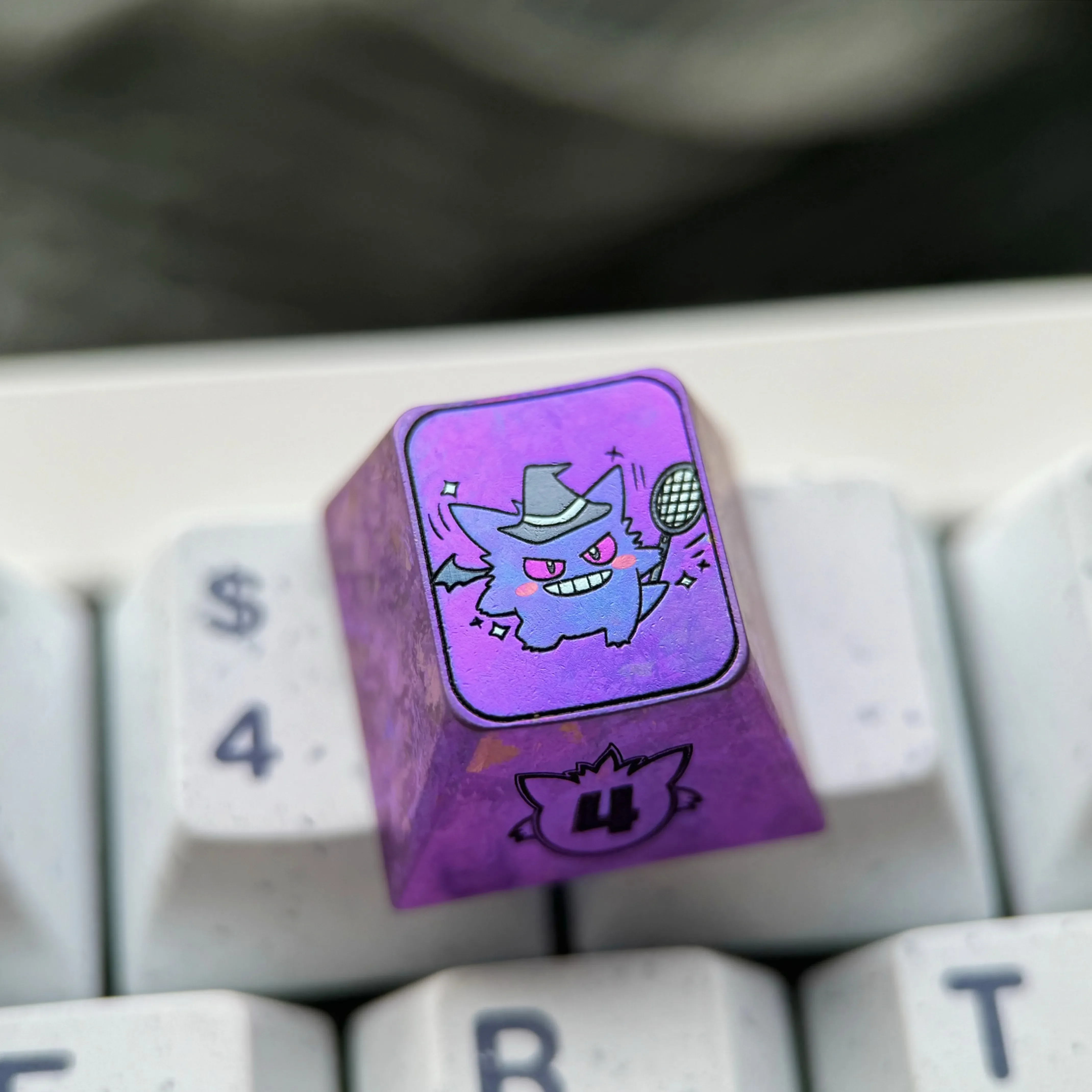 Premium titanium alloy Gengar artisan keycap with a striking metallic purple finish, showcasing an intricately stylized Gengar character for custom purpose.