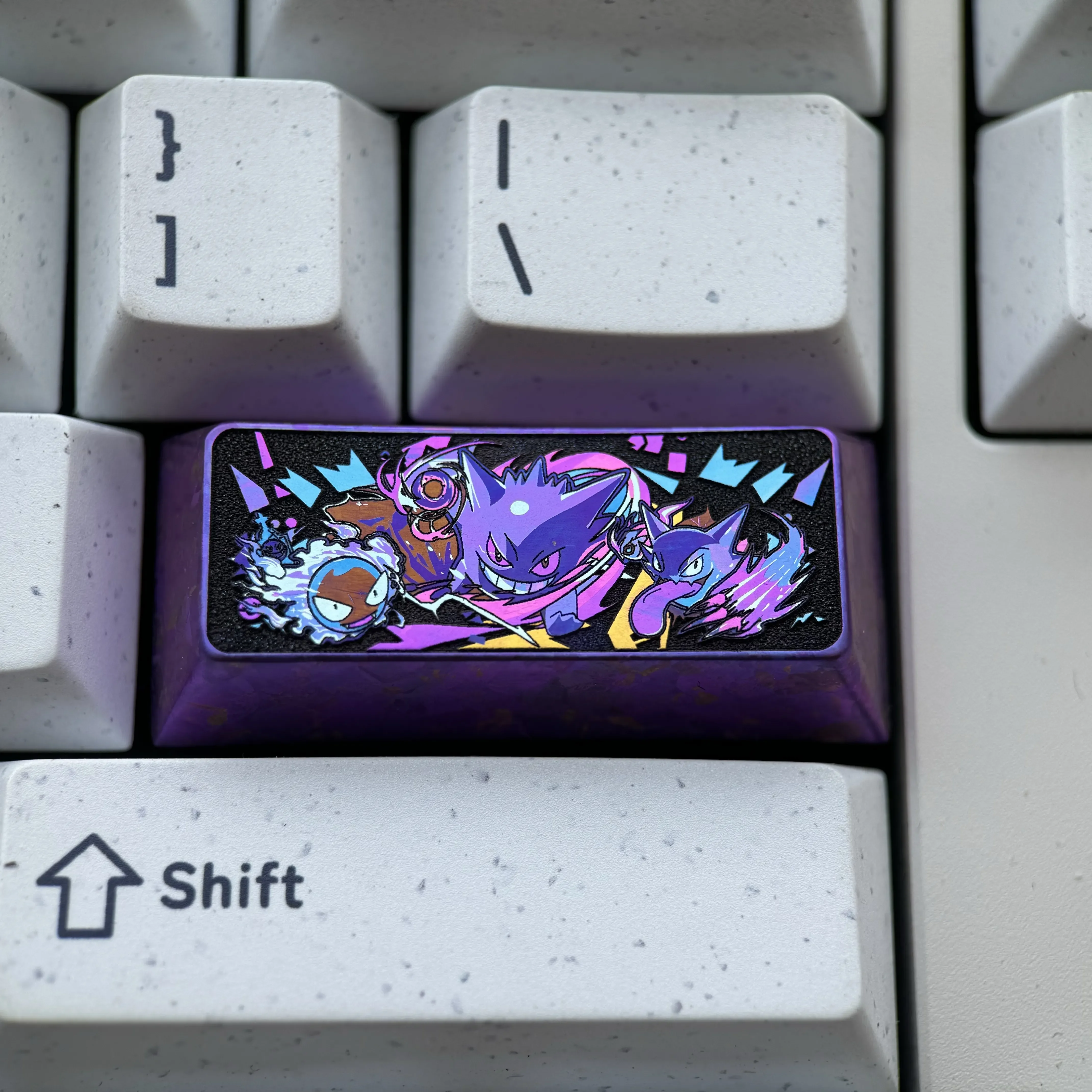 Playful and premium titanium Gengar keycap, a custom sculpted anime character for 2.25U left shift mechanical keyboards.