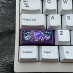 Playful Gengar keycap crafted from premium titanium, featuring a vibrant, intricately sculpted anime-inspired Gengar for a custom mechanical keyboard.