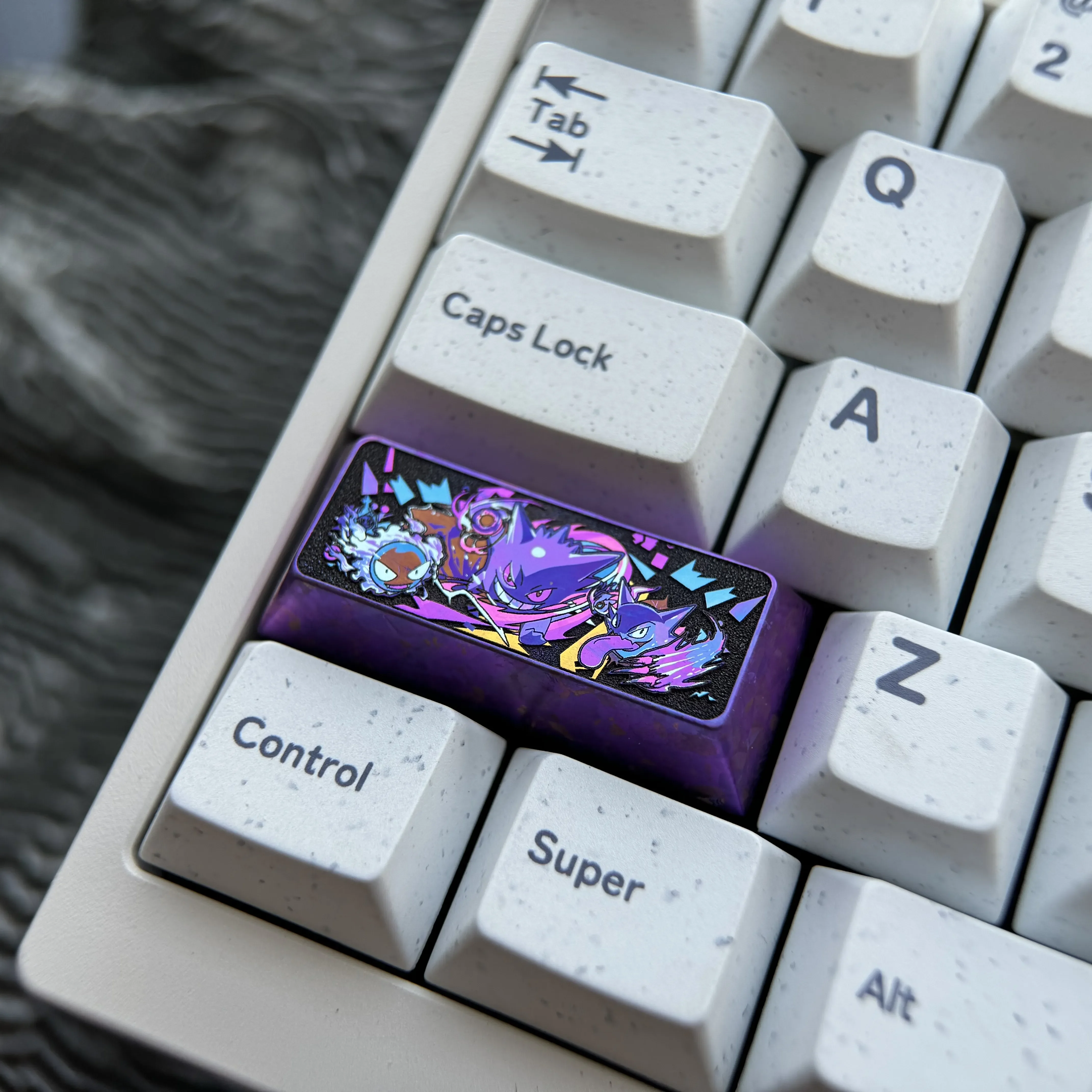 Detailed gallery views of the premium titanium Gengar keycap, highlighting its vibrant, sculpted anime design and custom craftsmanship from multiple angles.