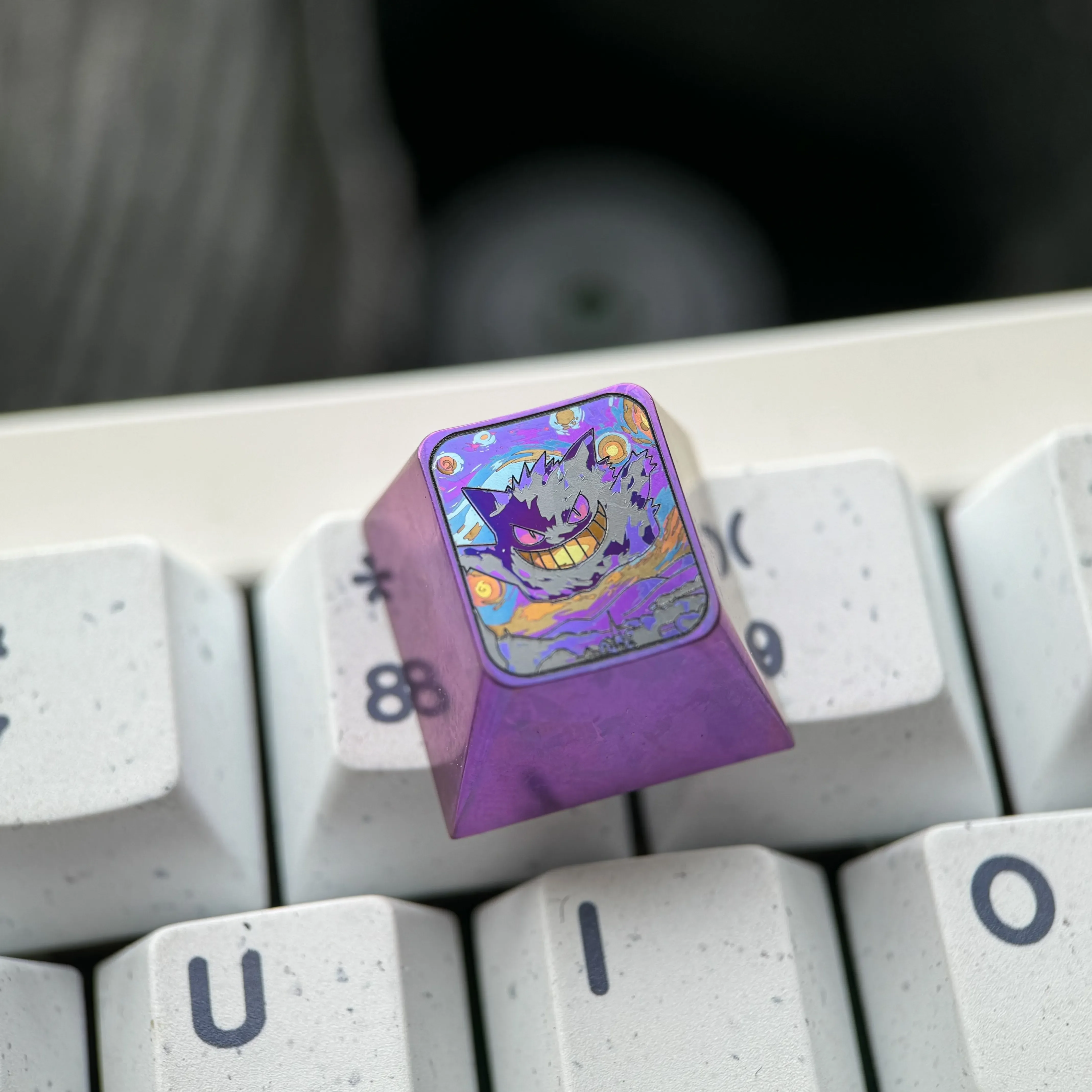 Vibrant Gengar titanium artisan ESC keycap, showcasing intricate anime detail and unique metallic finish. The iconic Gengar keycap for mechanical keyboard.