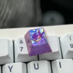 Vibrant Gengar titanium artisan ESC keycap for mechanical keyboards, showcasing intricate anime detail and playful artistry.