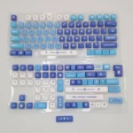 Elegant Furina PBT dye-sub keycap set for Genshin Impact, showcasing vibrant blue, white, and gold designs from multiple artistic angles.