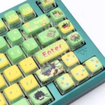 A collection of Genshin Impact Kinich creamy translucent keycaps set, showcased from multiple angles with a soft milky pastel glow, evoking ethereal fantasy design.