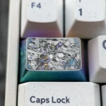 Premium Genshin Impact titanium keycaps featuring Raiden Shogun and Yae Miko, showcasing intricate anime engravings from multiple artistic angles.