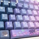 Exclusive Genshin Impact Wanderer PBT keycaps set from multiple angles, showcasing mystical blue-purple Scaramouche designs for an ethereal anime aesthetic.
