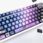 Exclusive Genshin Impact Wanderer PBT keycaps set from multiple angles, showcasing mystical blue-purple Scaramouche motifs for an artistic anime aesthetic.