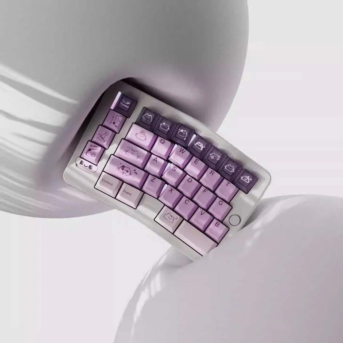Whimsical Grape Milkshake PBT keycaps set displayed from various angles, highlighting its unique dye-sublimated pastel purple and creamy white beverage design.