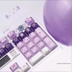 Grape Milkshake PBT keycaps set. Unique dye-sublimated pastel purple and creamy white design shown from multiple playful angles.