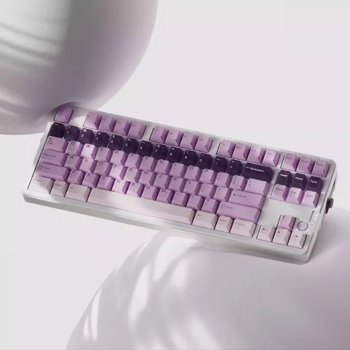 A close-up of the unique Whimsical Grape Milkshake PBT keycaps set, showcasing its sweet pastel purple and creamy white dye-sublimated aesthetic.