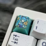 Close-up of the premium titanium Hatsune Miku keycap, showcasing its vibrant anime design with a sunflower motif and rich green accents from a unique keycap.