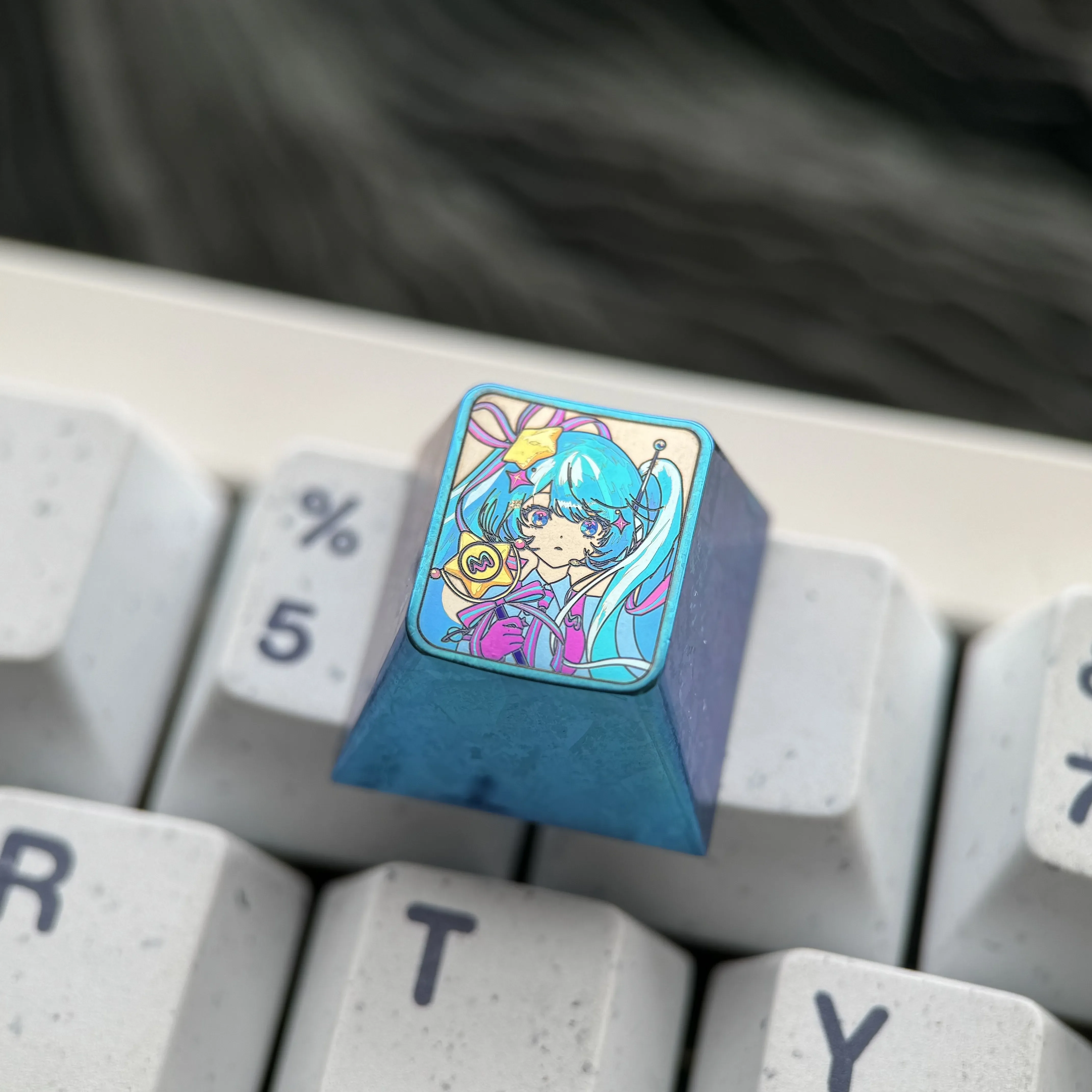 Detailed gallery of the exclusive Hatsune Miku Titanium keycap, featuring its iconic anime design, vibrant colors, and premium metallic craftsmanship.