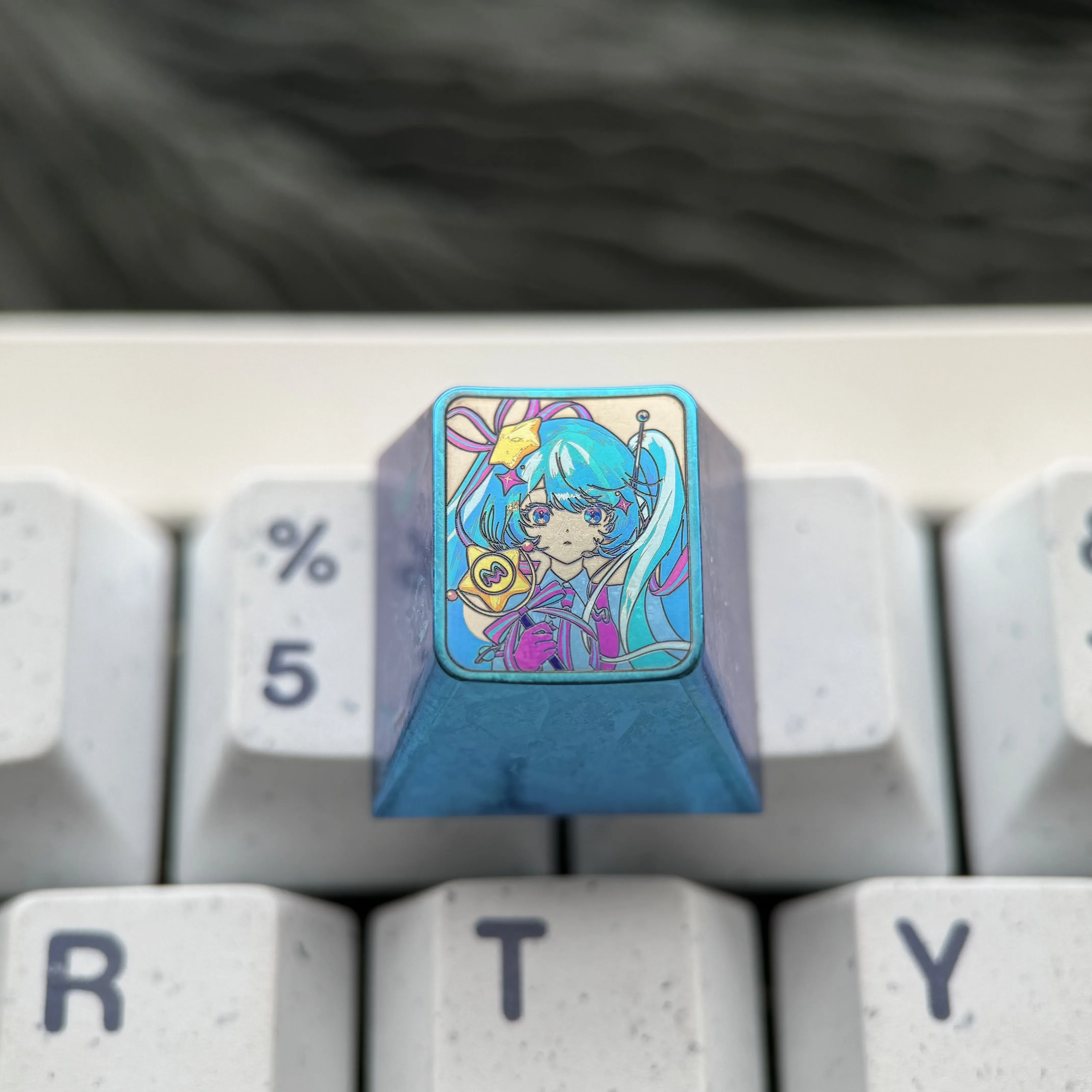 Gallery of the exclusive Hatsune Miku Titanium Keycap, highlighting its vibrant anime design, premium craftsmanship, and collectible ESC appeal.