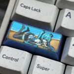 A collection of images showcasing the exclusive Hatsune Miku titanium keycap from various angles, highlighting its vibrant titanium finish.